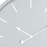 Close-up of the Hill Interiors Round Metal Wall Clock in grey, showing white baton markers and slim white hour and minute hands on a soft grey dial.