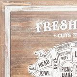 Close-up of Hill Interiors Pork Cuts wall plaque showing the whitewashed wooden frame, printed "Fresh Cuts" lettering and labelled pig diagram sections.