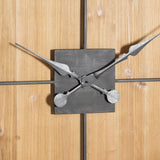 Close-up of Hill Interiors Large Square Wooden Wall Clock in brown, showing ornate silver metal hands on a square central plate against wood-effect panels.