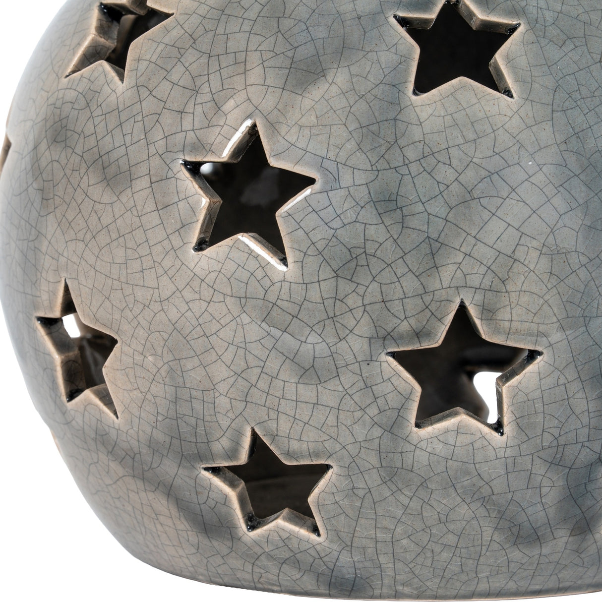 Close-up of Hill Interiors Large Star Candle Lantern in grey ceramic with crackle-glaze finish and pierced star-shaped cut-outs across its rounded form.