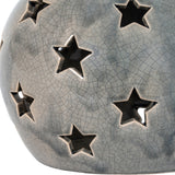 Close-up of Hill Interiors Large Star Candle Lantern in grey ceramic with crackle-glaze finish and pierced star-shaped cut-outs across its rounded form.