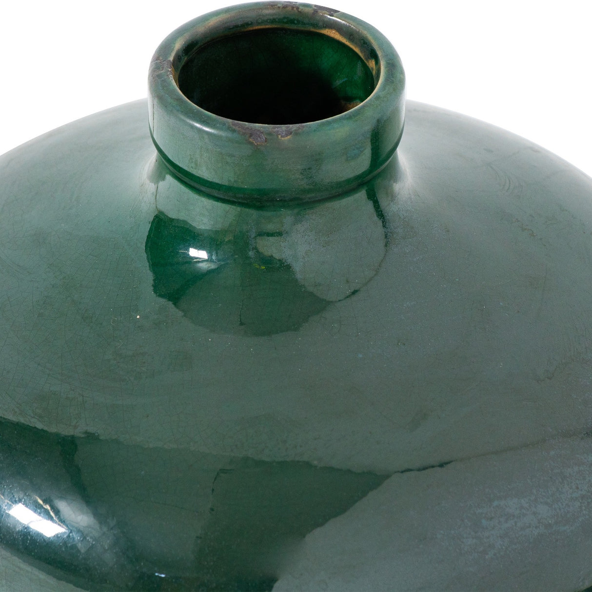 Close-up of Hill Interiors Eve vase's short rounded neck and emerald glazed ceramic shoulder, showing the crackled finish and subtle tonal shifts in green.