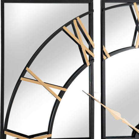 Close-up of Hill Interiors Black and Gold Round Wall Clock 113cm showing the black metal frame with gold Roman numerals and slim gold hand.