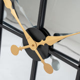 Close-up of Hill Interiors Black and Gold Round Wall Clock 113cm showing central black hub with ornate gold hour and minute hands over glass face.
