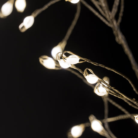 Close-up of Hill Interiors 2.75m plug-in LED cluster string lights, showing warm white bulbs densely gathered along fine wire against a black background.