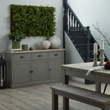 Hill Interiors Stone Ceramic Vases in beige with rounded stone-look forms on a wooden sideboard, styled with ferns, greenery and a dark staircase behind.