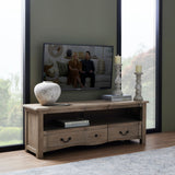 Hill Interiors Stone Ceramic Vase in beige with a rounded urn shape, styled on a wooden TV unit beside candles, books and a mounted television.
