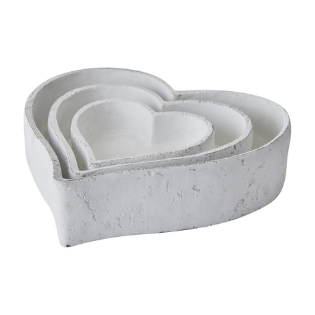 Hill Interiors set of three large matt white ceramic heart-shaped decorative bowls, nested from largest to smallest, shown on a plain white background.
