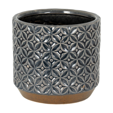 Hill Interiors 15cm ceramic planter with embossed geometric floral pattern in glossy grey, set on an unglazed natural clay base against a white background.