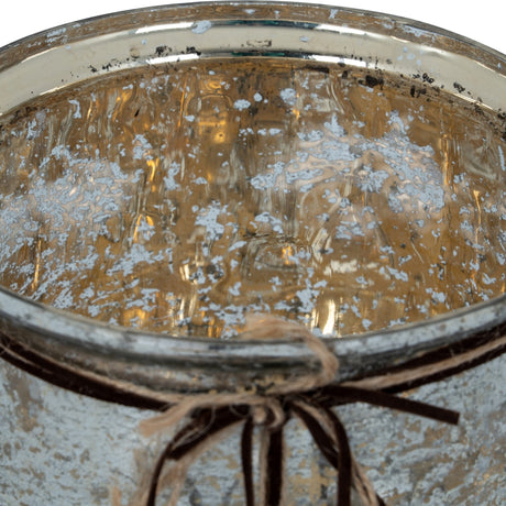 Close-up of the Hill Interiors Mercury Glass Heart Large Candle Holder showing the mottled silver-gold reflective finish inside and twine bow at the rim.