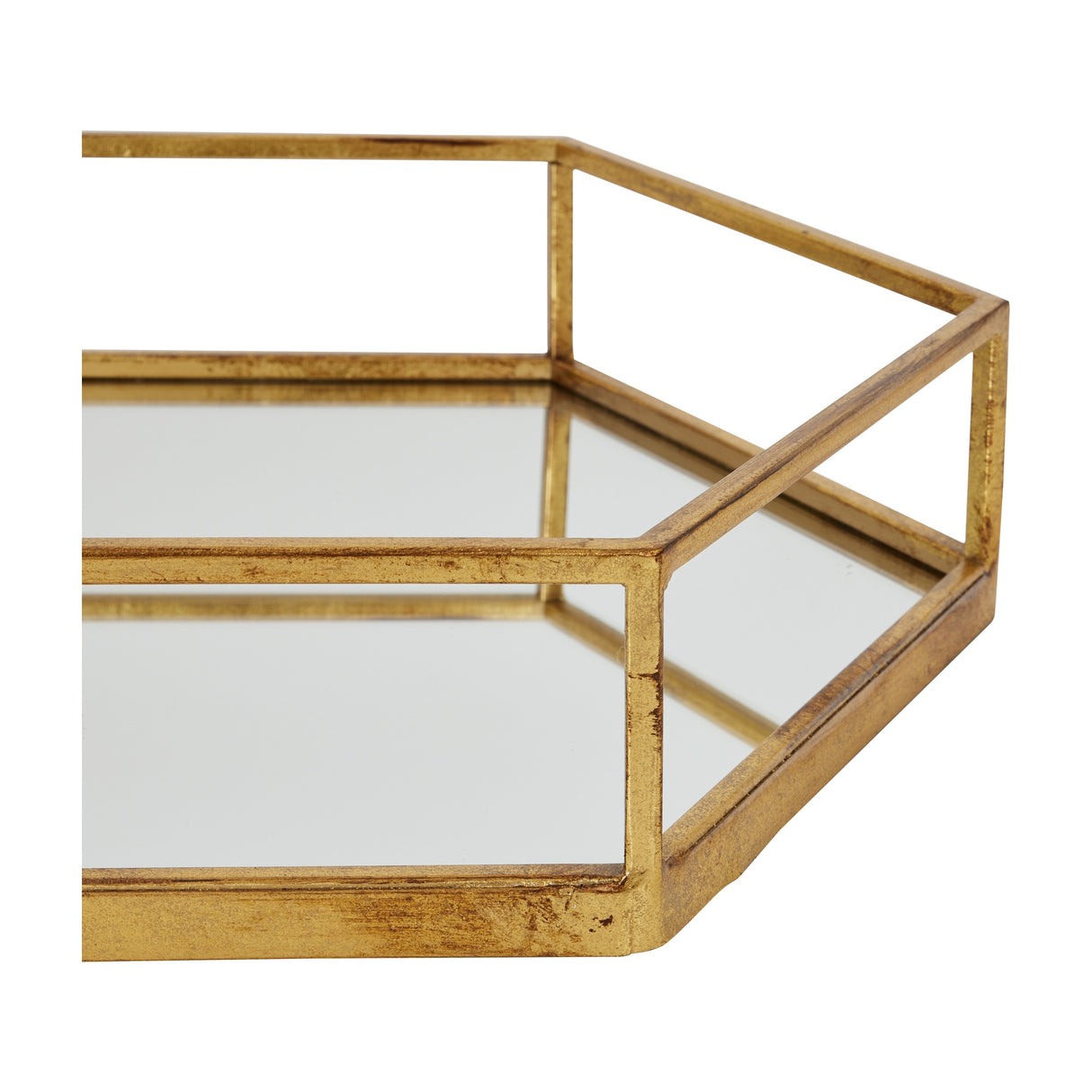 Close-up of Hill Interiors Hexagon Glass Tray in gold, showing the faceted six-sided metal frame and mirrored glass base against a white background.