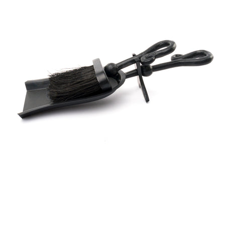Hill Interiors Black Crook Handled Hearth Tidy with matt black metal dustpan and looped-handle brush with dark bristles, shown on a white background.