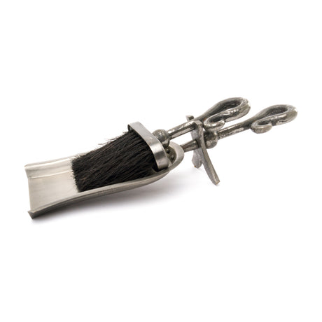 Hill Interiors Antique Pewter Crook Handled Hearth Tidy in silver, with a dark bristled brush and twin looped handles, shown on a plain white background.