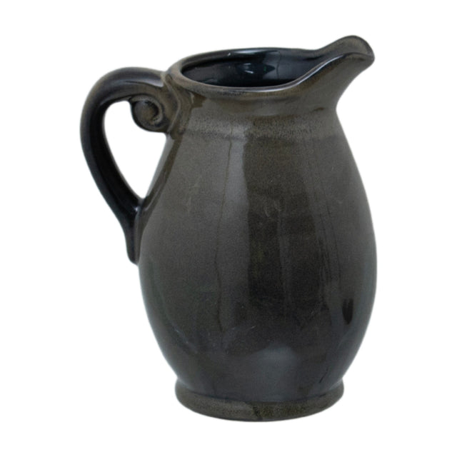 Hill Interiors 22cm green ceramic Olpe vase, a rounded jug-form vessel with curled handle, narrow spouted neck and glossy glaze, on a white background.