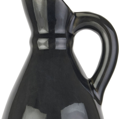 Close-up of Hill Interiors Decorative Tall Stoneware Jug in navy blue, showing the glossy ceramic glaze, slim neck and curved loop handle.