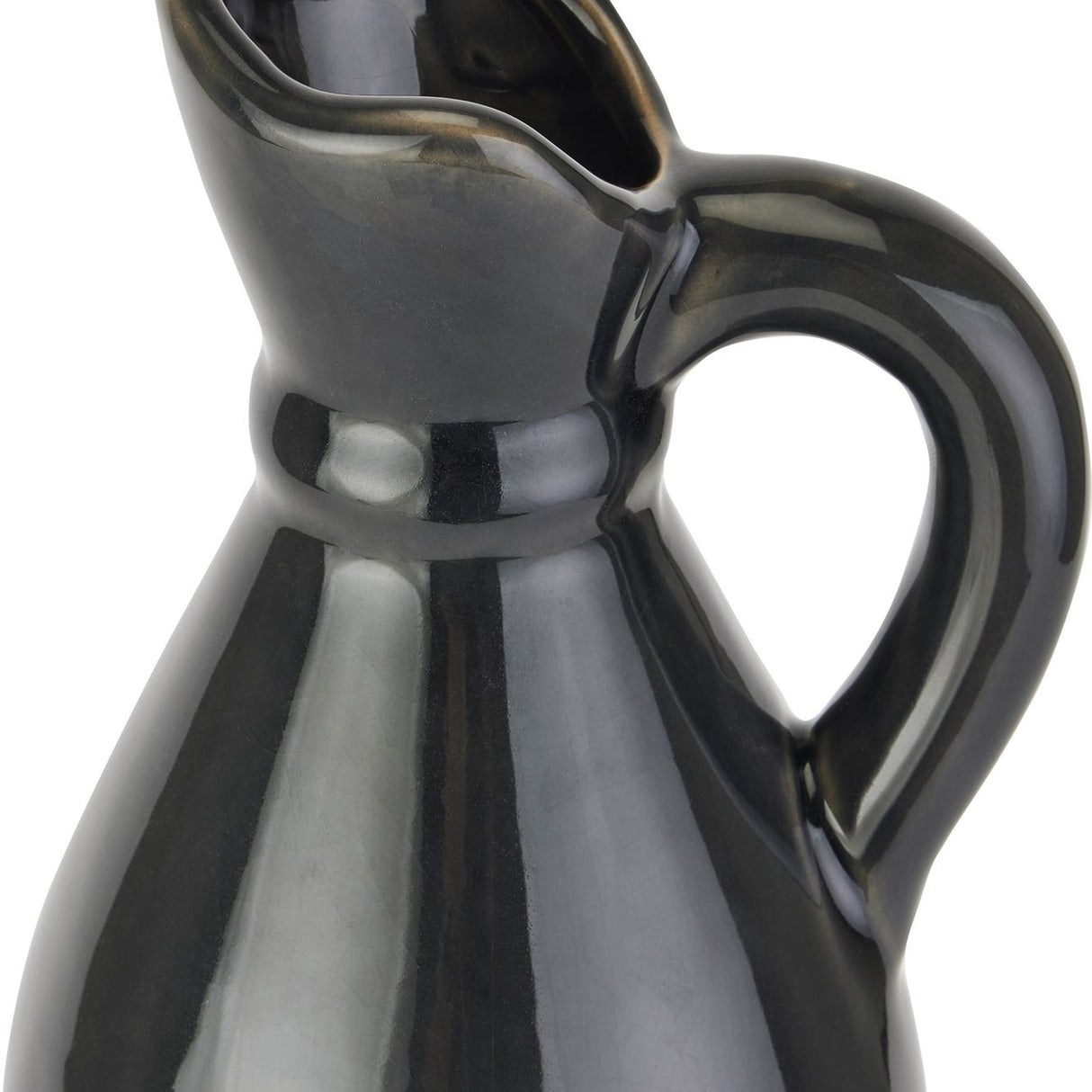 Close-up of Hill Interiors tall stoneware jug showing the pouring lip, curved handle and glossy navy-blue ceramic glaze against a white background.