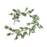 Hill Interiors LED winter garland with faux eucalyptus and lamb's ear foliage, coiled with battery pack visible, on a plain white background.