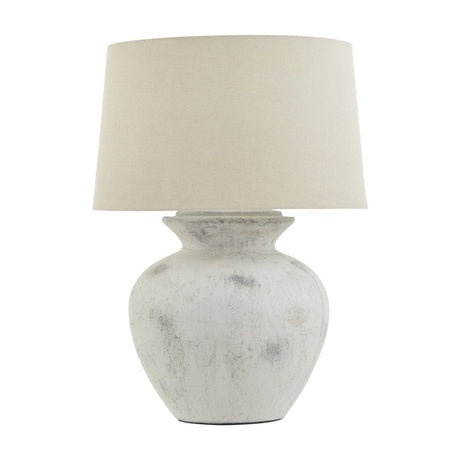 Hill Interiors 76cm ceramic table lamp with a rounded urn-shaped antique white glazed base and tapered neutral linen drum shade, on a plain background.
