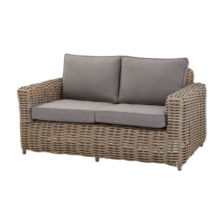 Hill Interiors two seater outdoor sofa with woven rattan-effect frame in natural tones and grey cushions, shown on a plain white background.