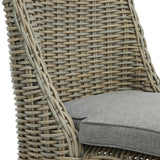 Close-up of the Hill Interiors Outdoor Dining Chair in beige, showing woven rattan-effect back and sides with a grey fabric seat cushion.