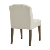 Hill Interiors Braxdon Bouclé Dining Chair in cream with rounded curved back, upholstered seat and tapered wooden legs, rear angle on white.