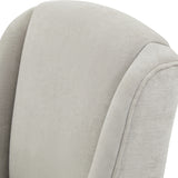Close-up of the Hill Interiors Braxdon Upholstered Dining Chair in grey, showing the woven fabric texture and piped seam along the curved backrest.