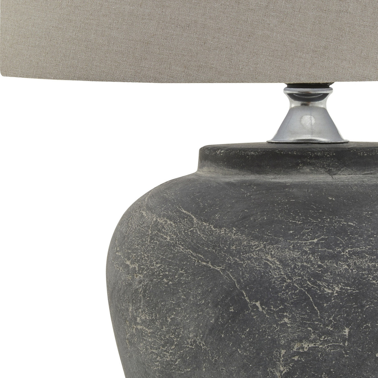 Close-up of the Hill Interiors Ferranock grey ceramic table lamp base with textured glaze finish and chrome fitting supporting a natural linen shade.