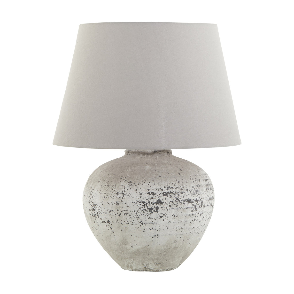 Hill Interiors Mestola large ceramic table lamp with a distressed beige stone-tone base and tapered cream drum shade on a plain white background.