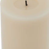 Close-up of the Hill Interiors Melt Effect LED Wax Pillar Candle in beige, showing the genuine wax body and moulded melt pool around the central LED wick.