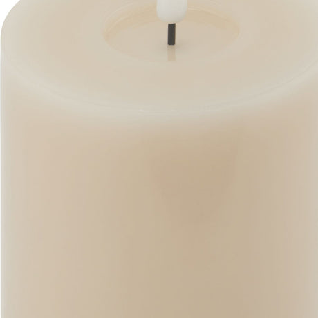 Close-up of the Hill Interiors Melt Effect LED Wax Pillar Candle in beige, showing the soft melted top edge and central LED wick.