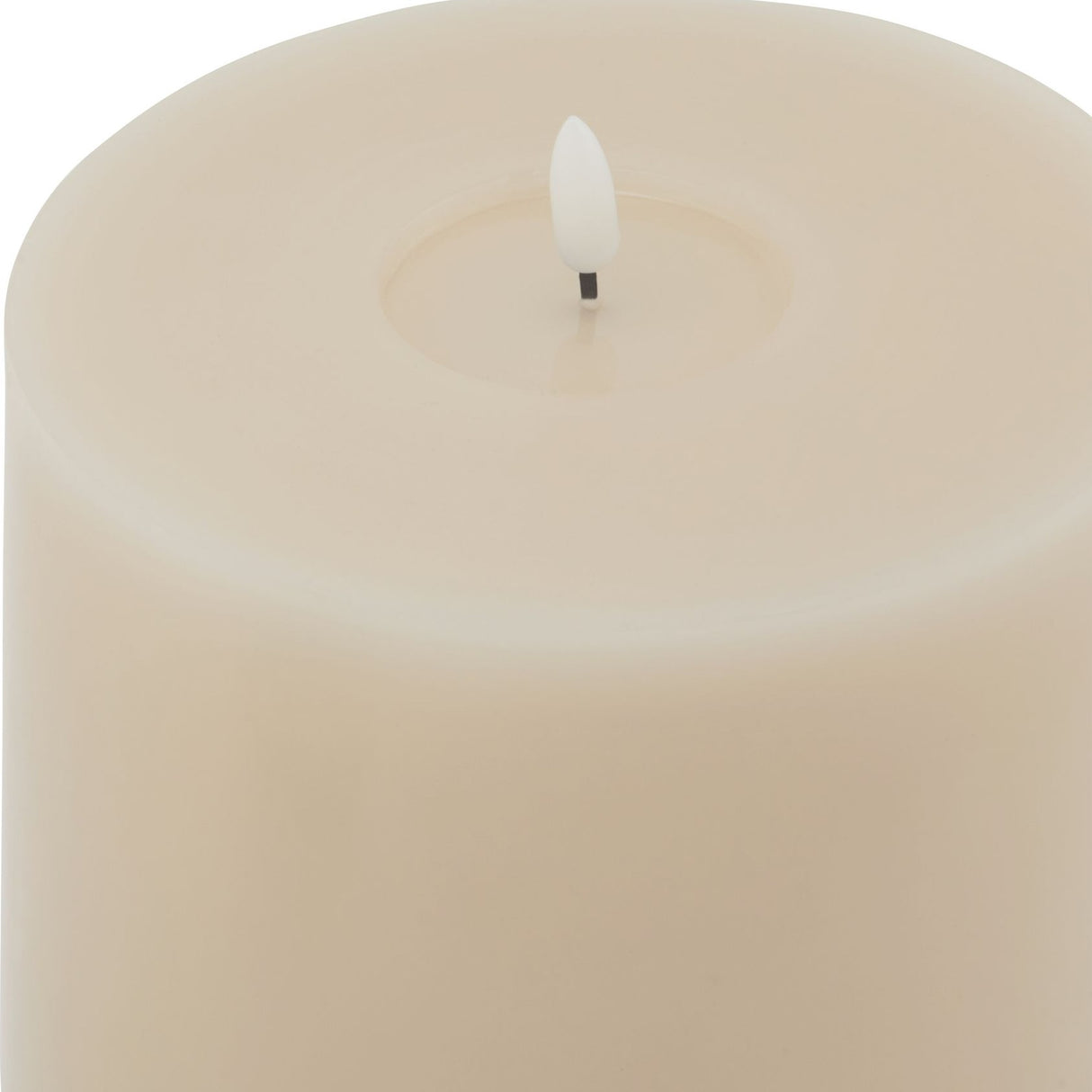Close-up of the Hill Interiors Melt Effect LED Wax Candle in beige, showing the flameless LED flame tip set into the smooth wax pillar top.