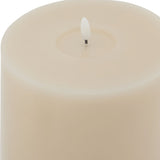 Close-up of the Hill Interiors Melt Effect LED Wax Candle in beige, showing the flameless LED flame tip set into the smooth wax pillar top.
