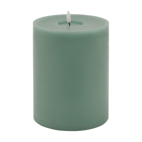Hill Interiors Melt Effect LED wax pillar candle in muted green with flickering flame tip and softly uneven top, shown on a plain white background.