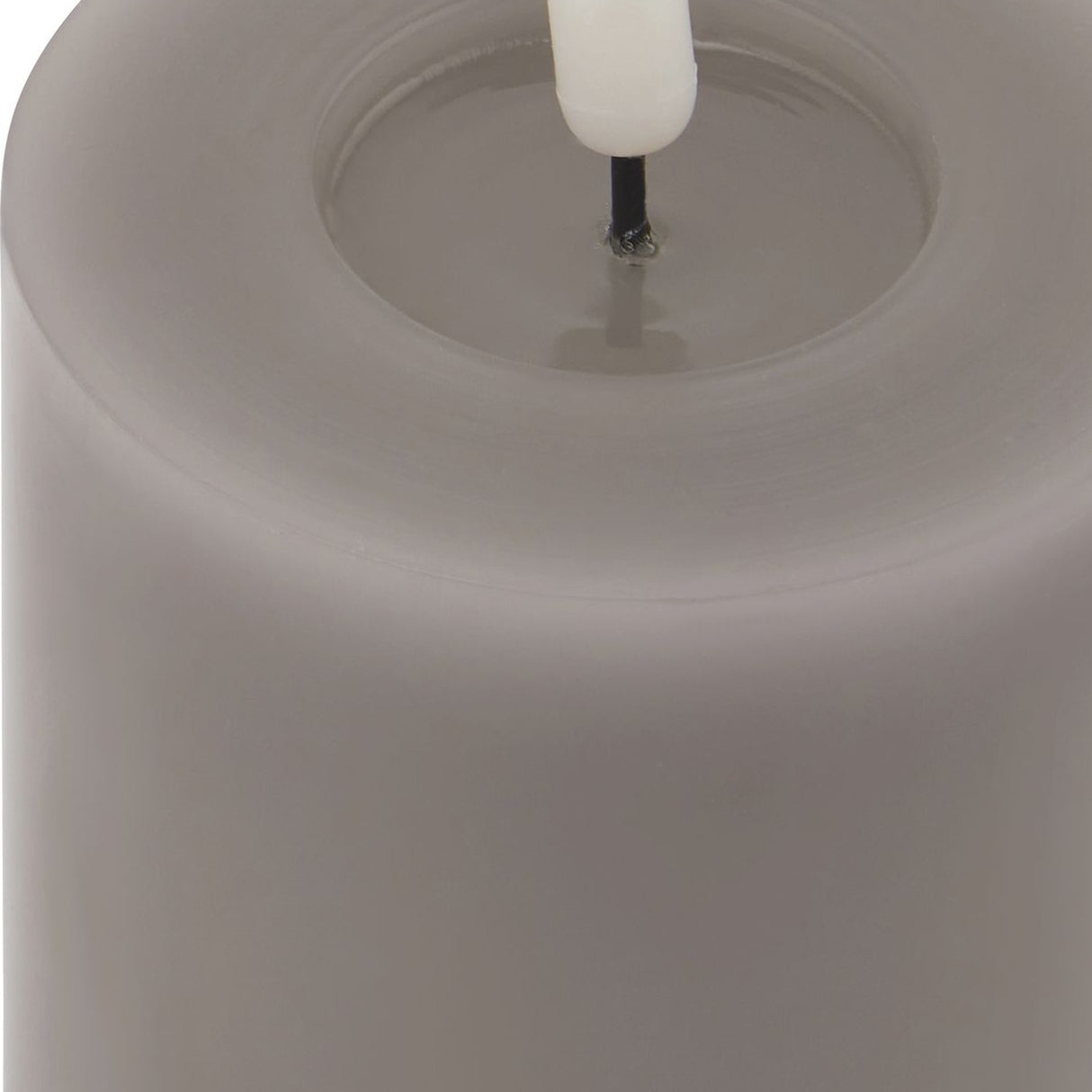 Close-up of the Hill Interiors Melt Effect LED Wax Candle in grey, showing the pillar's melted top edge and central LED wick.