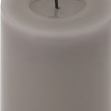 Close-up of Hill Interiors Melt Effect LED wax pillar candle in muted grey, showing the moulded pooled-wax top edge and smooth cylindrical body.