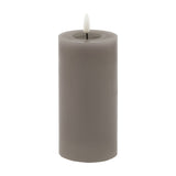 Hill Interiors Melt Effect LED Wax Pillar Candle in grey with a moulded pooled-wax top and realistic flame-shaped LED tip, shown on a white background.