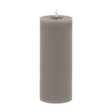 Hill Interiors Melt Effect LED wax pillar candle in grey with a realistic flickering flame and pooled wax top, shown on a plain white background.