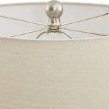 Close-up of the Hill Interiors Lattice Ceramic Table Lamp's natural linen drum shade and brushed nickel finial with spider fitting.