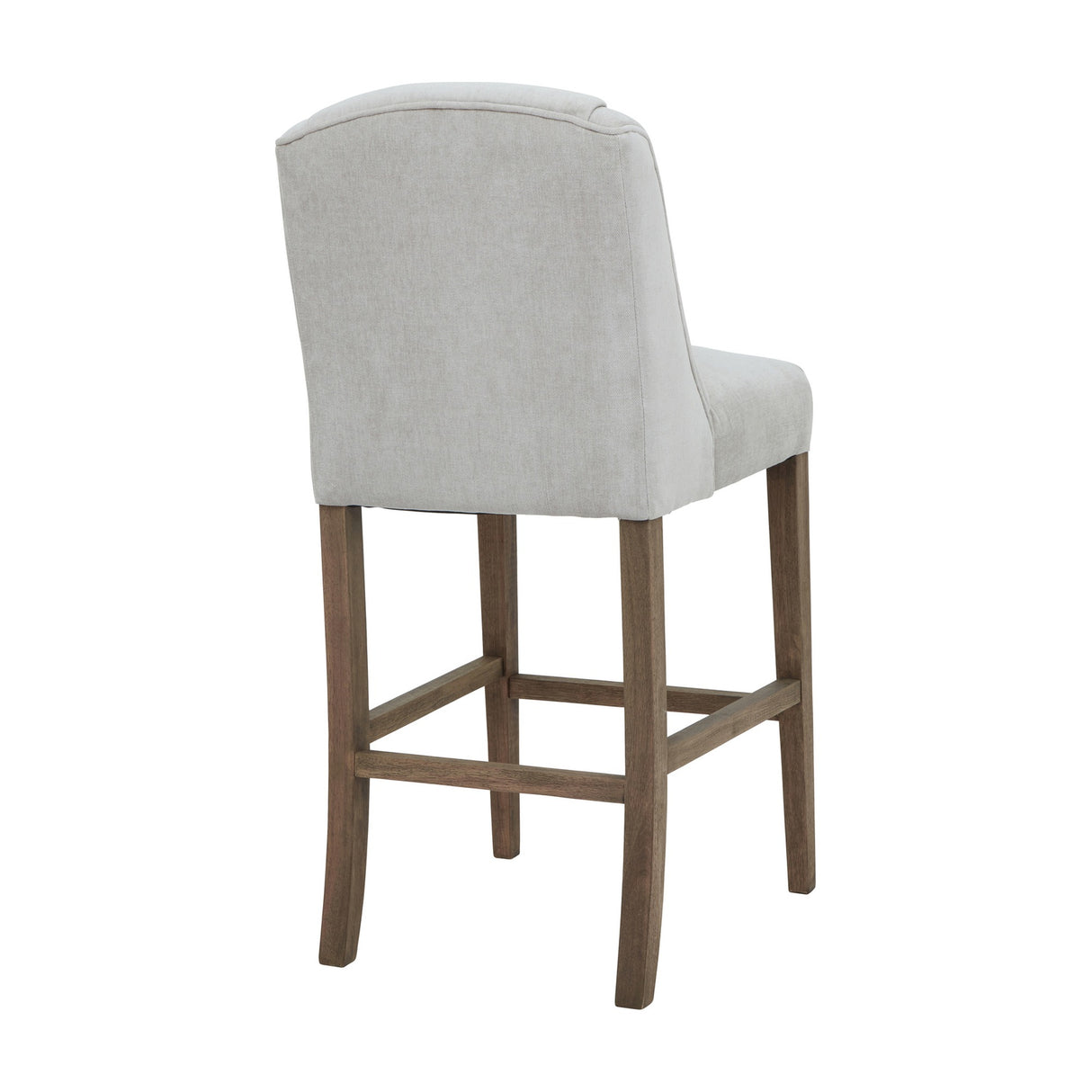 Rear view of the Hill Interiors Braxdon wooden bar stool in soft grey upholstery with a shaped back and four tapered wood legs, on a white background.