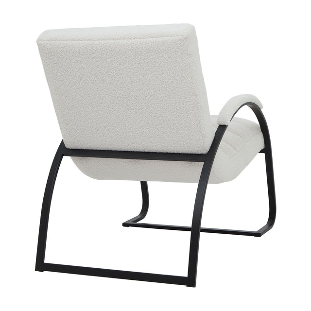 Hill Interiors Ribbed Ark Accent Chair in cream bouclé upholstery with a curved black metal frame, shown from the rear angle on a white background.