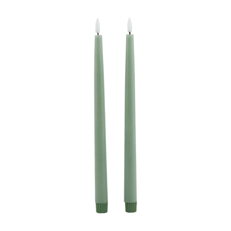 Hill Interiors Set of 2 LED Wax Dinner Candles in sage green, slim tapered form with lit flame tips, shown against a plain white background.