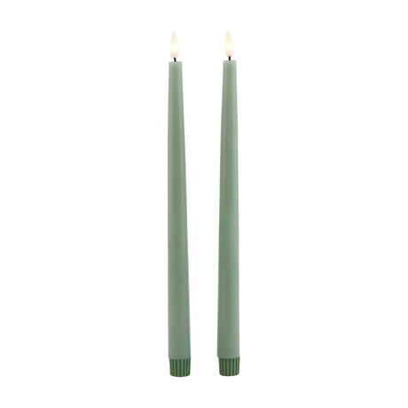 Hill Interiors set of two sage green LED wax dinner candles with slim tapered form and warm flickering tips, shown on a plain white background.