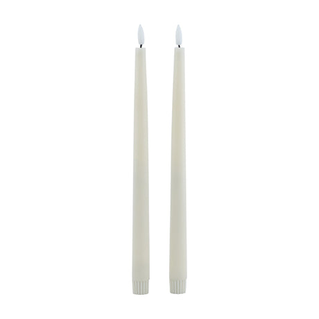 Hill Interiors set of two beige LED wax dinner candles with tapered form and flickering flame tips, shown against a plain white background.