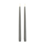 Hill Interiors set of two grey LED wax dinner candles, tall slim tapers with fluted bases and flickering flame tips, shown on a plain white background.
