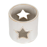 Hill Interiors White Ceramic Star Cut-Out Tealight Holder shown from above, compact cube with glazed white finish and star piercings, on a plain background.