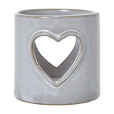 Hill Interiors white glazed ceramic tealight holder with a pierced heart cut-out on a cylindrical body, shown against a plain white background.