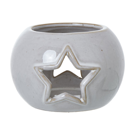 Hill Interiors White Ceramic Star Cut-Out Round Tealight Holder with smooth white glaze and pierced star motif, shown on a plain white background.