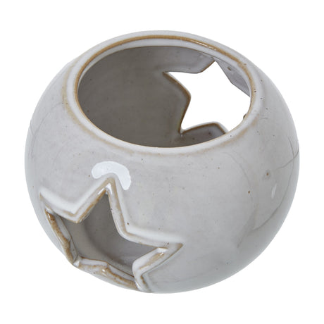 Hill Interiors white ceramic round tealight holder with star-shaped cut-outs pierced through the sides, shown on a plain white background.