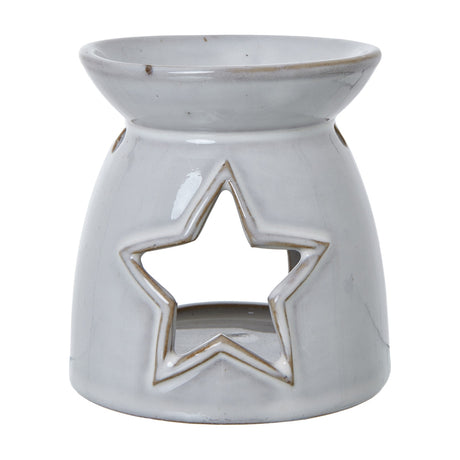 Hill Interiors white ceramic tealight and wax melt holder with pierced star cut-out and rounded glazed body, shown on a plain white background.