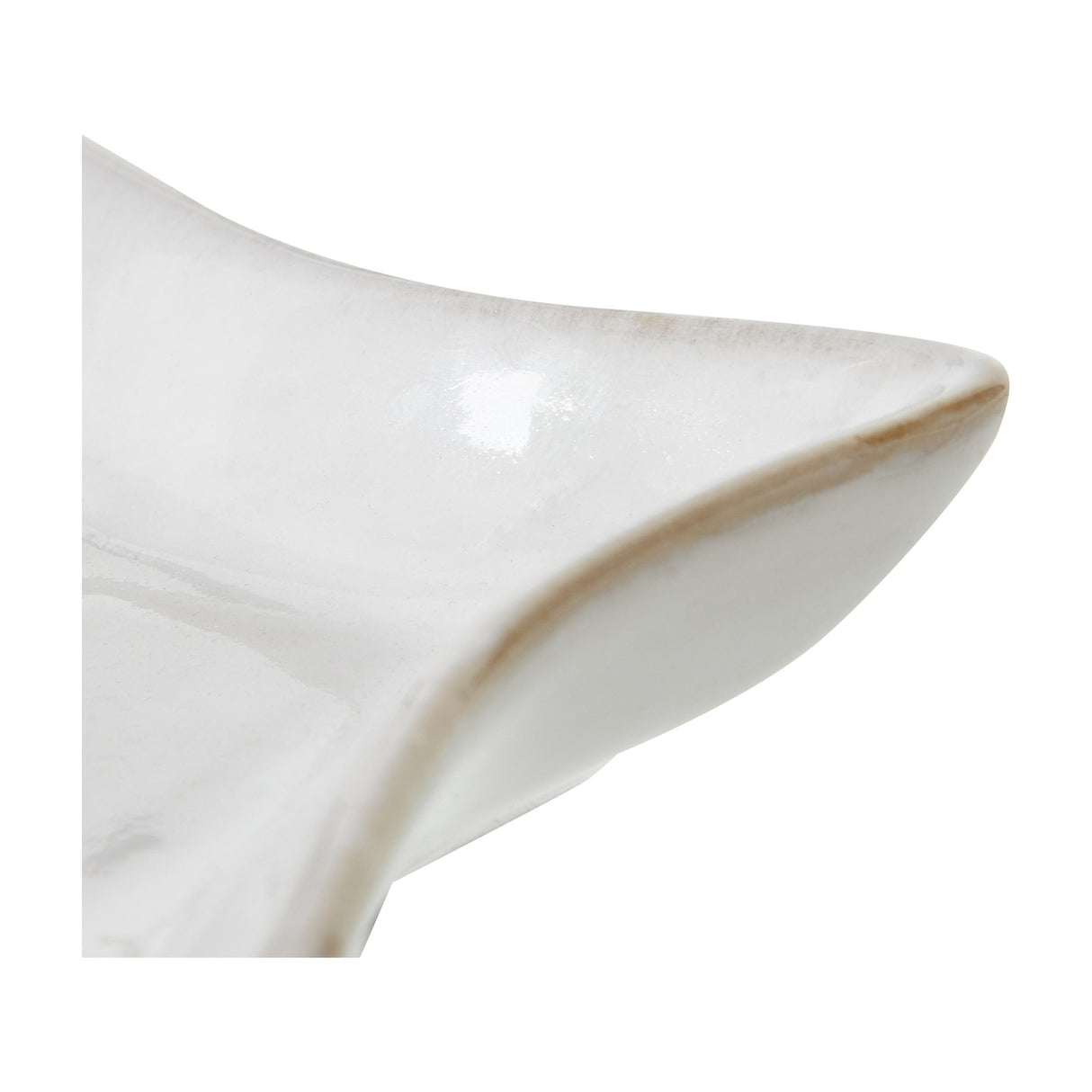 Close-up of Hill Interiors Small Ceramic Star Dish in white, showing the glazed finish and softly pointed edge with subtle brown rim detail.